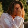 Person meditating peacefully with closed eyes, symbolizing relaxation.