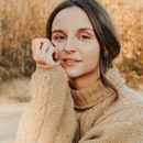 Portrait of Maria Kovalchuk smiling warmly.